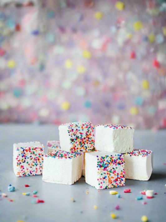 Small stack of yellow birthday cake marshmallows topped with sprinkles