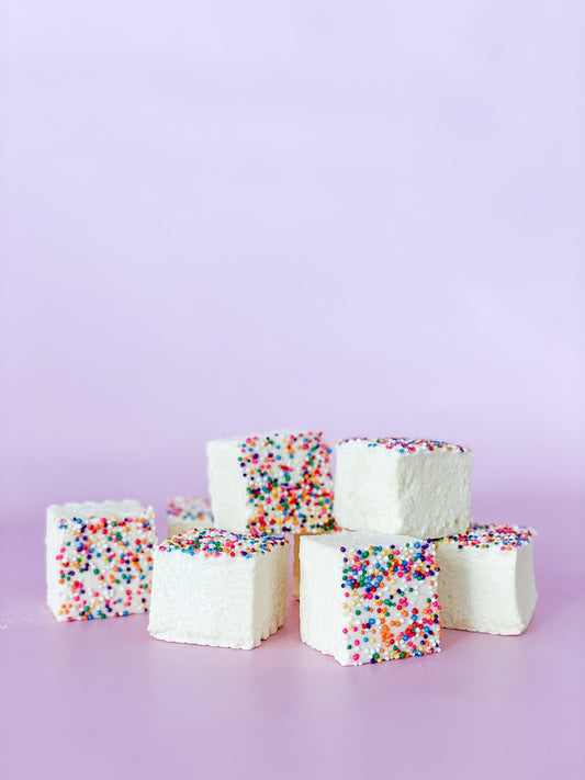 Small stack of yellow birthday cake marshmallows topped with sprinkles
